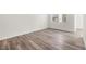 Bedroom featuring light hardwood flooring, lots of light, and new baseboards at 1832 N Decatur Blvd # 104, Las Vegas, NV 89108