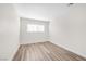 Bedroom featuring light hardwood flooring and a window at 1832 N Decatur Blvd # 104, Las Vegas, NV 89108