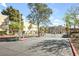 Gated community entrance featuring multiple units and lush landscaping on a sunny day at 1832 N Decatur Blvd # 104, Las Vegas, NV 89108