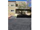 A condo unit with covered parking, a walkway, and desert landscaping at 1832 N Decatur Blvd # 104, Las Vegas, NV 89108