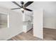 Bright kitchen features a new ceiling fan, lots of light, and white cabinets at 1832 N Decatur Blvd # 104, Las Vegas, NV 89108
