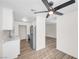Bright kitchen features stainless steel appliances, light wood flooring, and white cabinets at 1832 N Decatur Blvd # 104, Las Vegas, NV 89108