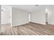 The living room features light wood flooring and is freshly painted at 1832 N Decatur Blvd # 104, Las Vegas, NV 89108