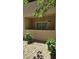 Private outdoor patio space that features xeriscaping, lush greenery, and direct access to the home at 1832 N Decatur Blvd # 104, Las Vegas, NV 89108
