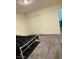 Minimalist bedroom with carpet floors, a double door closet, and modern features at 1885 Vass Springs Pl, North Las Vegas, NV 89084