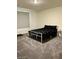 Comfortable bedroom with carpet, a window, and simple furnishings at 1885 Vass Springs Pl, North Las Vegas, NV 89084