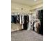Walk-in closet with clothing and storage at 1885 Vass Springs Pl, North Las Vegas, NV 89084