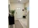 Bright foyer features neutral tones, patterned rug, updated lighting, and a convenient coat closet at 1885 Vass Springs Pl, North Las Vegas, NV 89084