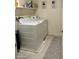 This laundry room features a large washing machine and dryer, ample counter space, and contemporary decor at 1885 Vass Springs Pl, North Las Vegas, NV 89084
