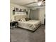 Stylish main bedroom features neutral tones, carpet floors, and a tufted headboard at 1885 Vass Springs Pl, North Las Vegas, NV 89084