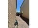 Narrow side yard featuring gravel, providing a functional and low-maintenance outdoor space at 1885 Vass Springs Pl, North Las Vegas, NV 89084