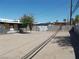 An empty dirt backyard with privacy walls and mature tree at 1912 Statz St, North Las Vegas, NV 89030