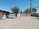 Spacious dirt backyard with a concrete block wall and some greenery at 1912 Statz St, North Las Vegas, NV 89030