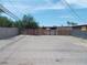 View of backyard featuring a wood fence and utility poles, no landscaping at 1912 Statz St, North Las Vegas, NV 89030