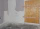 Bare bedroom showcasing walls with unfinished paint and boarded up window, ready for complete renovation at 1912 Statz St, North Las Vegas, NV 89030