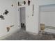An unfinished bedroom with patched walls and an open closet, ready for a creative design transformation at 1912 Statz St, North Las Vegas, NV 89030