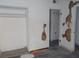 A bedroom with damaged walls, showcasing closet and doorway ready for a complete renovation to your liking at 1912 Statz St, North Las Vegas, NV 89030