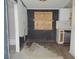 Kitchen featuring dark trim, peeling paint and updated cabinetry at 1912 Statz St, North Las Vegas, NV 89030