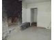 Living room featuring rock fireplace and access to other rooms at 1912 Statz St, North Las Vegas, NV 89030