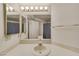 Bathroom with a large mirror, standard toilet, shower with curtain, and white vanity at 1944 Las Palmas Ln # 174, Laughlin, NV 89029