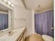 Bathroom featuring a large vanity, standard toilet, and shower with curtain at 1944 Las Palmas Ln # 174, Laughlin, NV 89029