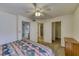 A portion of a bedroom featuring a ceiling fan, carpet, and view of ensuite bathroom and closet at 1944 Las Palmas Ln # 174, Laughlin, NV 89029