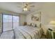 Comfortable bedroom featuring sliding glass doors and overhead lighting at 1944 Las Palmas Ln # 174, Laughlin, NV 89029