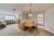 Open dining area features a charming light fixture, fireplace, and access to the living room and bedroom at 1944 Las Palmas Ln # 174, Laughlin, NV 89029