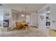 Bright dining area with hardwood table set, leading to the kitchen and bedroom, ideal for Gathering meals at 1944 Las Palmas Ln # 174, Laughlin, NV 89029