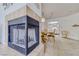 Inviting condo featuring a fireplace, dining table, and adjacent kitchen area at 1944 Las Palmas Ln # 174, Laughlin, NV 89029