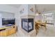 Cozy living space with fireplace, dining area, and a TV setup for relaxing evenings at 1944 Las Palmas Ln # 174, Laughlin, NV 89029