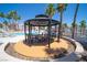 Outdoor gazebo with a table and seating, perfect for dining and relaxation at 1944 Las Palmas Ln # 174, Laughlin, NV 89029
