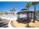 Charming community gazebo with table and chairs, with pool in the background at 1944 Las Palmas Ln # 174, Laughlin, NV 89029