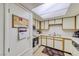 Efficient kitchen with white cabinets, modern appliances, and direct access, ready for culinary adventures at 1944 Las Palmas Ln # 174, Laughlin, NV 89029