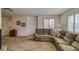 Living room with white walls, plush carpeting, shuttered windows, and a comfortable couch at 1944 Las Palmas Ln # 174, Laughlin, NV 89029