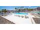 Community pool with lounge chairs, gazebo, and desert landscaping at 1944 Las Palmas Ln # 174, Laughlin, NV 89029