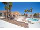 A community pool with lounge chairs, desert landscaping, and shaded seating at 1944 Las Palmas Ln # 174, Laughlin, NV 89029