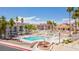 Community pools, lounge seating, and fountain, all accented by lush landscaping at 1944 Las Palmas Ln # 174, Laughlin, NV 89029