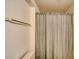 Shower with neutral colored curtain and silver hardware at 1944 Las Palmas Ln # 174, Laughlin, NV 89029