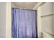 Shower with blue curtain and neutral walls, with a standard toilet at 1944 Las Palmas Ln # 174, Laughlin, NV 89029