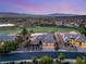 Stunning aerial view of a house in a golf course community with lush landscaping and mountain views at 20 Kittansett Loop, Henderson, NV 89052