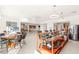 Entertaining space with a bar, seating, and an open layout connecting to the dining and kitchen areas at 20 Kittansett Loop, Henderson, NV 89052