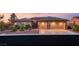 Charming single-story home featuring a well-manicured front yard, desert landscaping and a two-car garage at 20 Kittansett Loop, Henderson, NV 89052