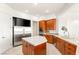 Bright kitchen features stainless steel refrigerator, sleek countertops, and modern cabinets providing ample storage space at 20 Kittansett Loop, Henderson, NV 89052