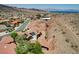 A high angle drone shot of a desert neighborhood with mountain views and a blue sky backdrop at 205 Red Rock Rd, Boulder City, NV 89005
