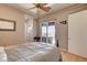 Bedroom with a ceiling fan and sliding glass doors leading to a balcony and backyard at 205 Red Rock Rd, Boulder City, NV 89005