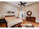This spacious bedroom features tray ceilings, hardwood floors, and a walk-in closet at 205 Red Rock Rd, Boulder City, NV 89005