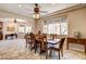 Elegant dining room featuring custom lighting, large windows, and easy access to other rooms at 205 Red Rock Rd, Boulder City, NV 89005