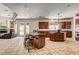 Gourmet kitchen featuring wooden cabinetry, granite countertops, and an island with seating at 205 Red Rock Rd, Boulder City, NV 89005