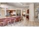 Open kitchen with a large island, bar seating, and stainless steel appliances at 205 Red Rock Rd, Boulder City, NV 89005